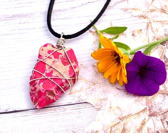 Pink Imperial Jasper wrapped in sterling silver wire, complete with black neck cord