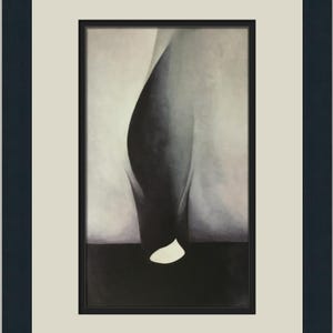 May include: Abstract black and white art print in a black frame with a white mount. The artwork features a curved, organic shape against a soft, blurred background. The bottom portion is a solid black, with a white shape.