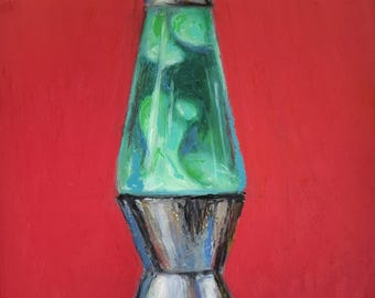 May include: A retro lava lamp with a silver base and top, and a clear glass body filled with green and blue wax. The lamp is set against a solid red background, creating a vibrant contrast. The lamp's design is reminiscent of the 1960s and 1970s.