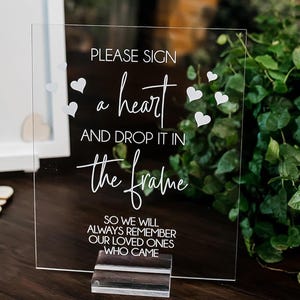 Please Sign A Heart And Drop It Into The Frame Clear Glass Look Acrylic Wedding Sign, Photo Booth Station Guest Book Lucite Table