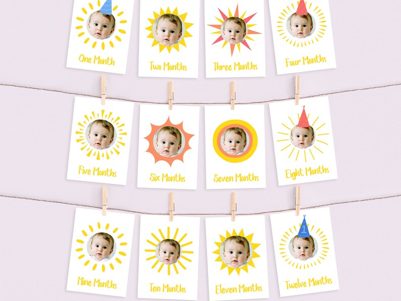 May include: Twelve yellow sun-shaped cards with a baby's photo in each. Each card has a different month of the year written on it, from one to twelve months.