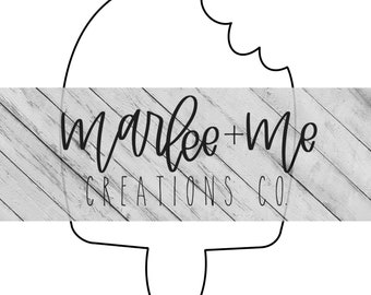 May include: A black and white outline of a popsicle with a bite taken out of it. The popsicle is surrounded by a white wooden background with the text "marlee+me CREATIONS CO."