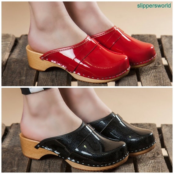 red patent leather clogs