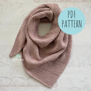 May include: A pink knitted triangle scarf against a white background. The text "PDF PATTERN" is written in a circle on the image.