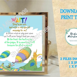 May include: A framed print with a Dr. Seuss-inspired design. The print features a colorful hot air balloon, whimsical illustrations, and the text "WAIT! Stop by you see. And write a very special message to me!"