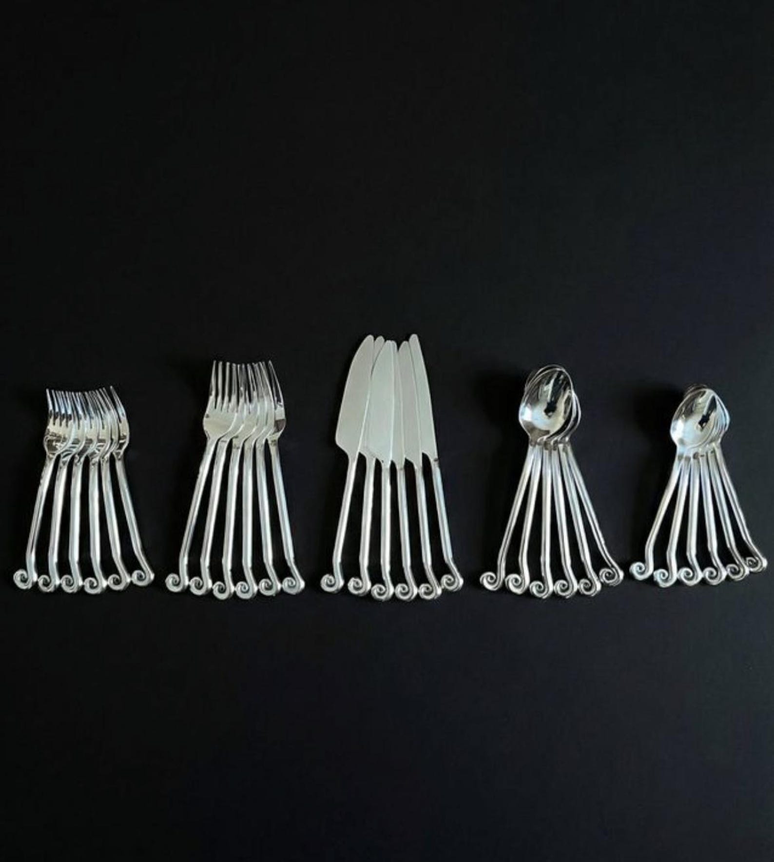 30-piece cutlery set with swirling spiral design – 18/10 stainless steel, silver finish – mid-century modernist style, 1980s