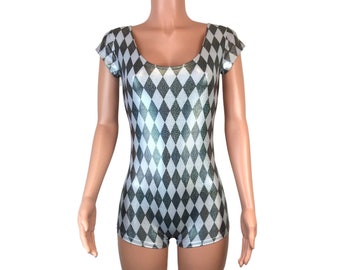 May include: A short-sleeved bodysuit with a diamond pattern in black and silver. The fabric has a shiny, metallic finish.