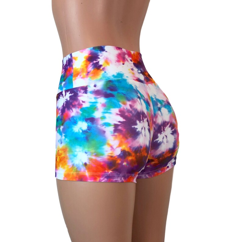 May include: High-waisted athletic shorts with a colorful tie-dye pattern in shades of purple, orange, blue, and green.