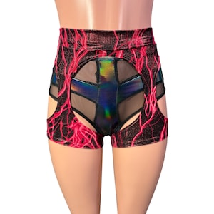 May include: High-waisted shorts with a striking design. The shorts feature a black and red lightning bolt pattern, with cut-out sides and a central panel of iridescent material and mesh. The garment is designed for a bold, eye-catching look.