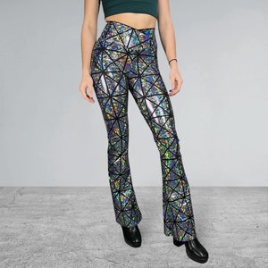 May include: Silver and black high-waisted flared pants with a geometric pattern.