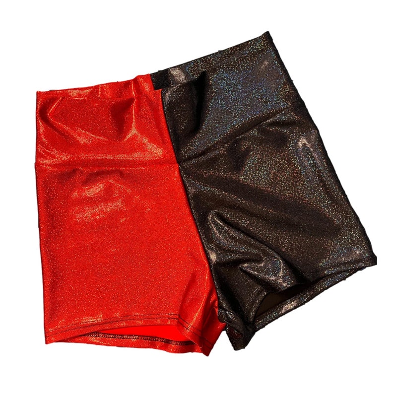 May include: Red and black shiny shorts with a glittery finish.
