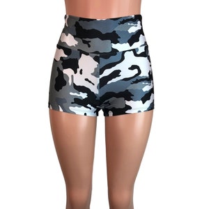 May include: High-waisted shorts with a camouflage print in shades of gray, black, and white.