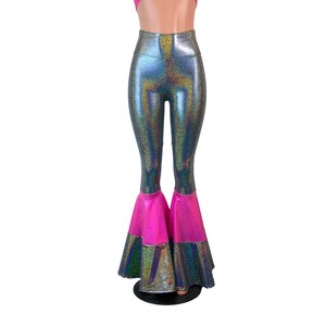 May include: High-waisted flared trousers with a silver iridescent fabric and a pink trim at the bottom of the legs.