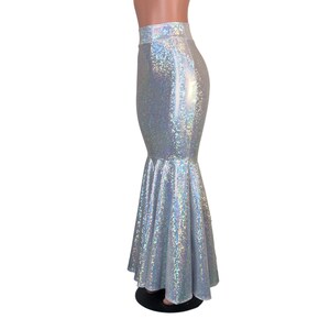 May include: A silver iridescent mermaid skirt with a fitted top and a flared bottom. The skirt is made of a stretchy, shiny fabric.