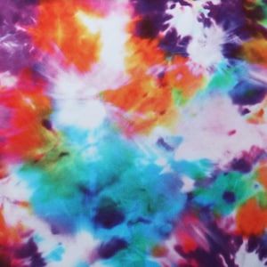 May include: Abstract tie-dye pattern in shades of orange, pink, purple, blue, and green. The background is white.