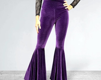 May include: Purple velvet bell bottom pants with a high waist and a wide leg.