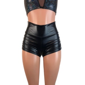 May include: Black high-waisted shorts made of shiny fabric. The shorts have a fitted silhouette and a short length.