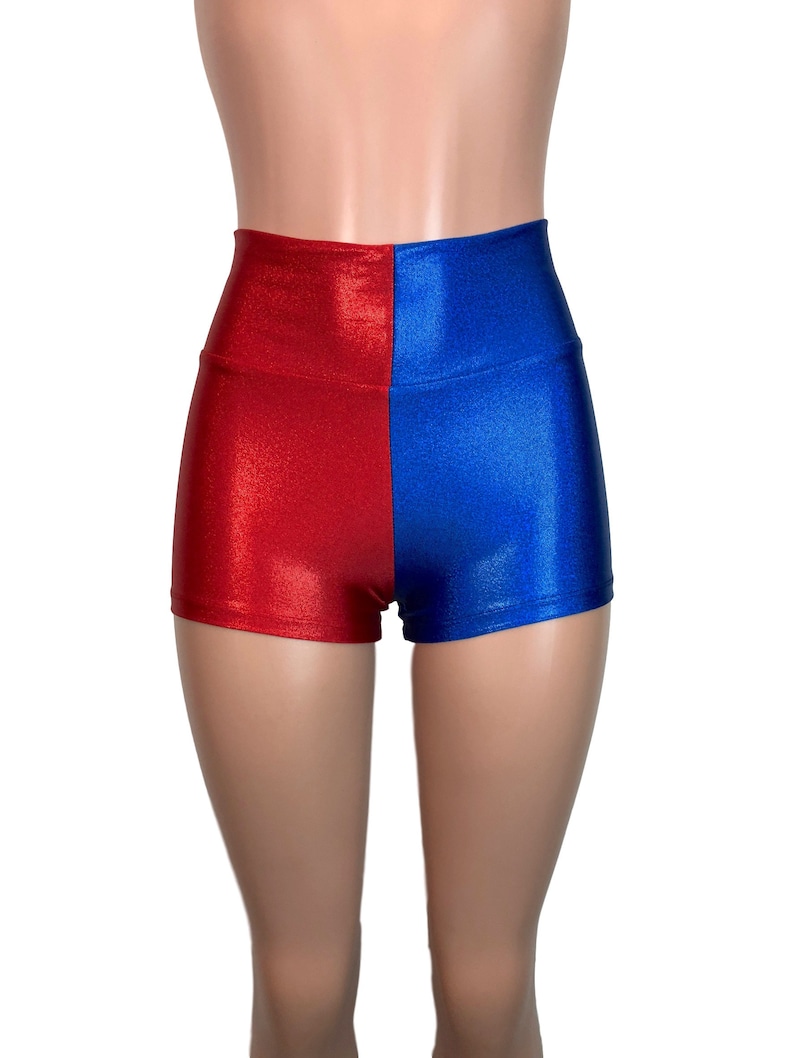 May include: High-waisted shorts with a red and blue color block design. The shorts are made of a shiny, stretchy fabric.