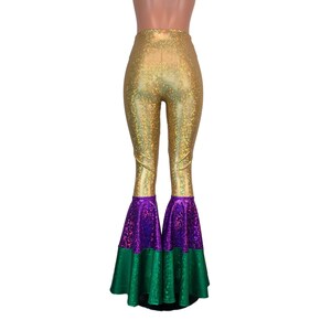 May include: Gold, purple and green flared trousers with a high waist and a sparkly finish.