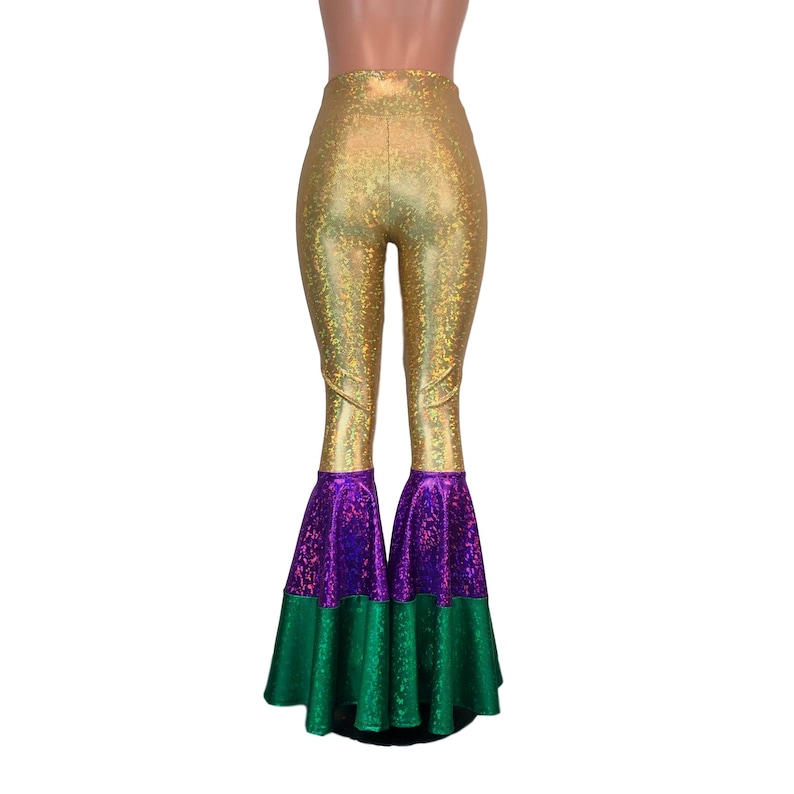 May include: Gold, purple and green flared trousers with a high waist and a sparkly finish.