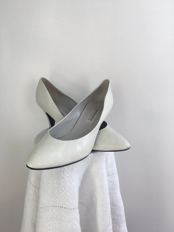 white leather court shoes