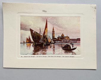 May include: A vintage print depicting a Venetian scene with boats on the water. The image features sailboats with colorful sails, a gondola, and buildings with a tall bell tower. The text at the bottom reads: "12. - Isola di S. Giorgio - Ile de St. George - The Isle of S. Giorgio - Die Insel S. Giorgio."