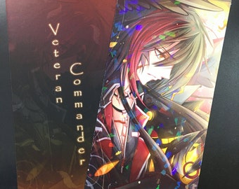May include: A bookmark featuring a colorful anime character with red and black hair, wearing a black and red jacket. The text "Veteran Commander" is on the bookmark.