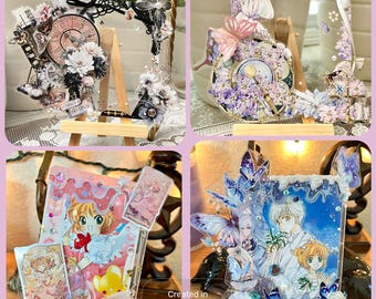 May include: Four decorative acrylic displays featuring clocks, flowers, and butterflies. One display has a clock face with the word "REVIVAL". Another has a pink and red anime-style illustration. The third has a blue and white anime-style illustration. The fourth has a clock face with purple flowers.