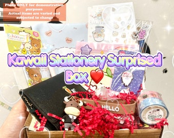 May include: A brown cardboard box filled with a variety of kawaii stationery items, including stickers, washi tape, a small plush toy, a keychain, and a black wallet. The box is decorated with red and white tissue paper and the text "Kawaii Stationery Surprised Box" is printed on the front.