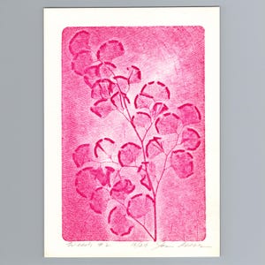 May include: A rectangular print on white paper featuring a magenta ink botanical illustration of a fern-like plant. The artwork displays a textured background with visible cross-hatching lines. Handwritten text at the bottom reads Weeds #2 13/29.