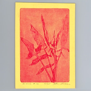 May include: A rectangular print on yellow paper featuring a red botanical illustration of a plant with multiple pointed leaves. The artwork includes handwritten text at the bottom, reading "Weeds #12" and "7/25" followed by a signature in black ink.
