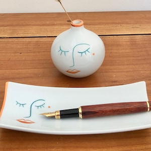 The soliflor vase and the hand-painted porcelain pencil holder