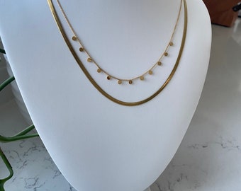 The polka-dot chain: hypoallergenic stainless steel, and the gold is 14 karat gold filled. 18” necklace