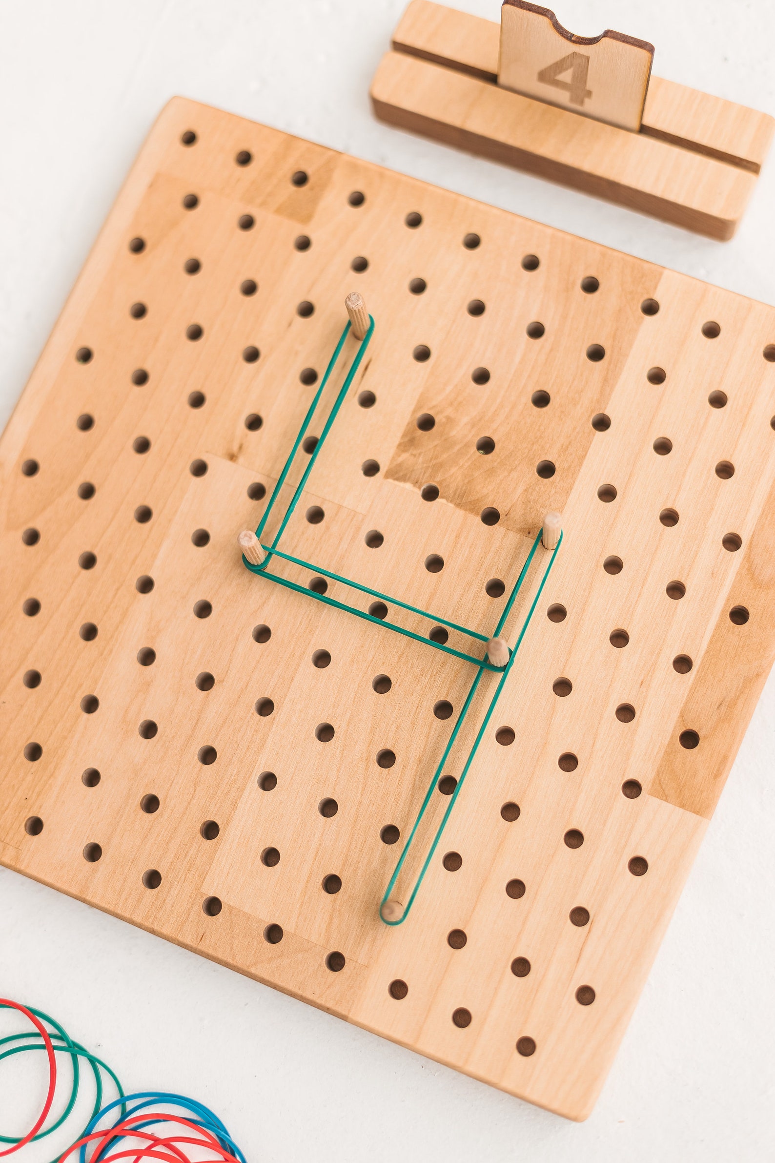 Colorful rubber bands addition to wood geoboard pegboard for Etsy