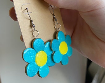 Brincos de flor azul