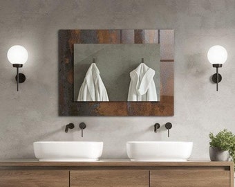 Puede incluir: Un baño moderno con un tocador doble, un espejo grande y una ducha a ras de suelo con una alcachofa de lluvia. Las paredes son de hormigón gris claro y el tocador es de madera.