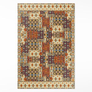 May include: A colorful rug with a geometric pattern in shades of orange, blue, red, and black. The rug has a cream-colored background and a border with a repeating pattern.