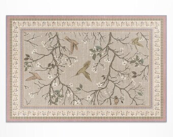 May include: Rectangular area rug with a nature-inspired design. The rug features a light gray background with a pattern of hummingbirds, flowering branches, and a decorative border in shades of pink, beige, and green.