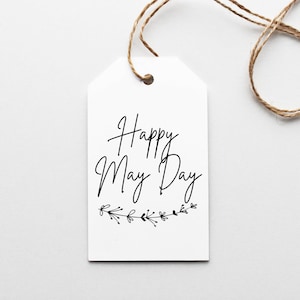 May include: White gift tag with black script lettering that reads "Happy May Day" with a small floral design underneath.