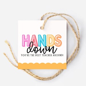 May include: A white gift tag with a colorful "Hands Down" message and the text "You're the best teacher around!" The tag has a scalloped edge and a yellow background.