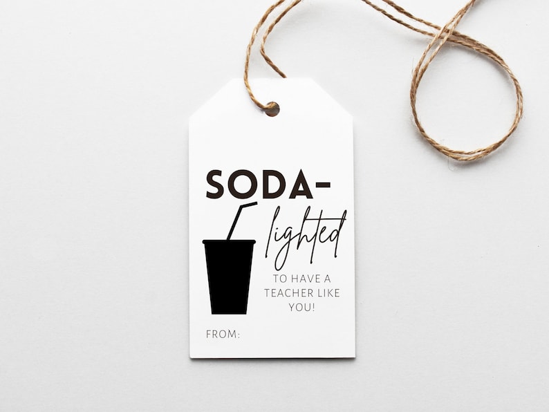 May include: A white gift tag with black text that reads "SODA-lighted to have a teacher like you!" with a black silhouette of a cup with a straw. The tag has the words "FROM:" at the bottom.