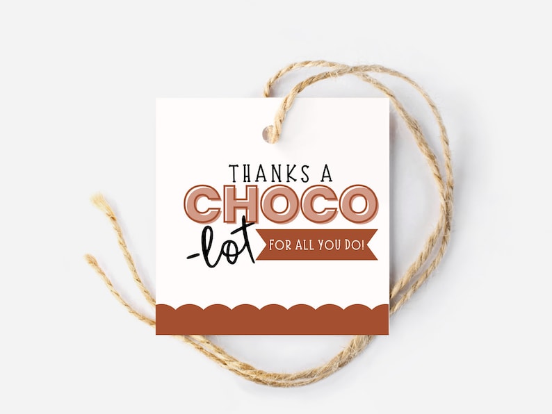 May include: A white gift tag with brown scalloped edges and a brown ribbon. The tag says "Thanks a Choco-lot for all you do!"