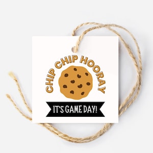 May include: A white gift tag with a brown chocolate chip cookie illustration and the text "Chip Chip Hooray! It's Game Day!"