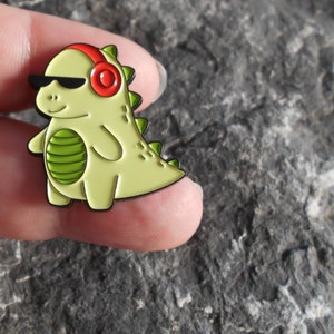 Dinosaurier Brosche Pin , verschiedene Designs, Anstecker, Metall, emailliert, Dino Kopfhörer