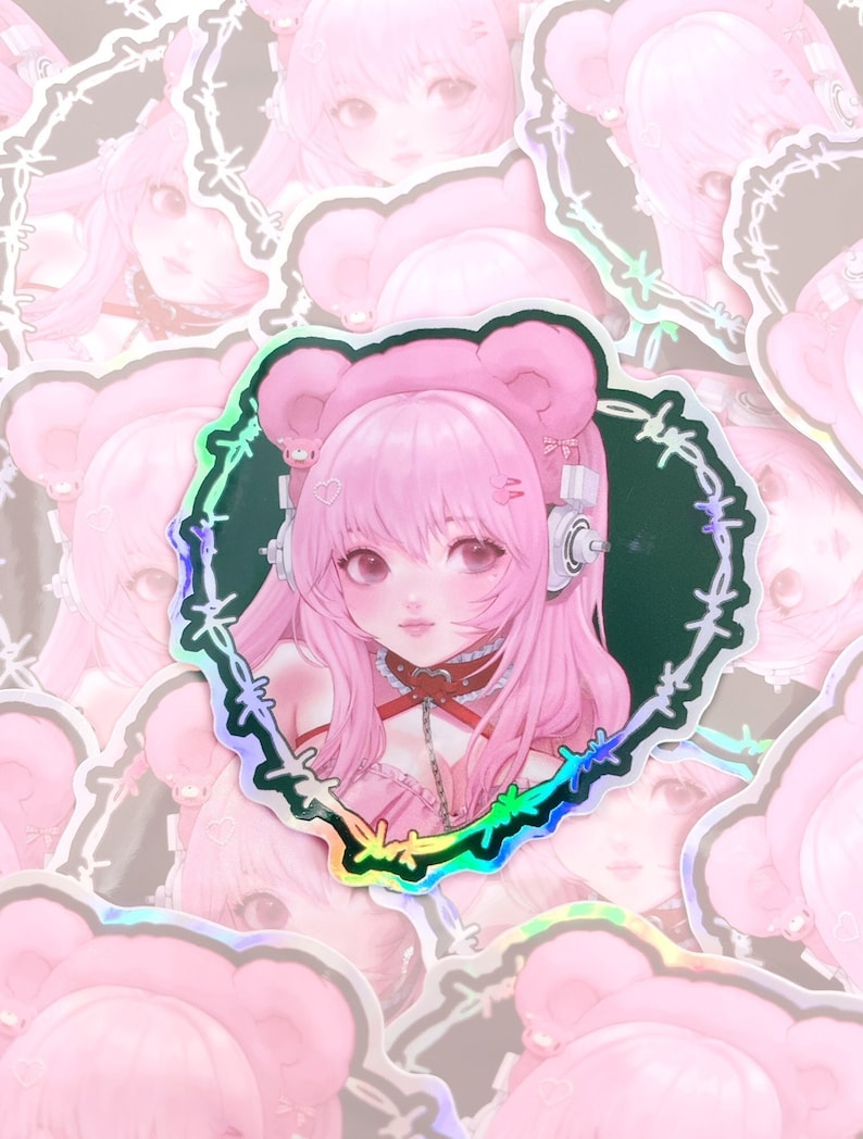 May include: A sticker featuring a pink anime character with bear ears and a choker. The character is surrounded by a barbed wire design with a rainbow iridescent finish.