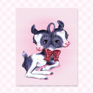 May include: A digital illustration of a two-headed black and white calf with large dark eyes, pink noses, and ears, wearing a dark red bow around its neck. The creature is depicted in a reclining position against a light pink background with dots.