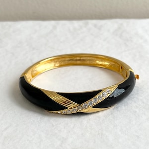 Vintage 1980s Joan Rivers Hinged bangle With Locking Clasp. Gold, Black Enamel and White Rhinestones