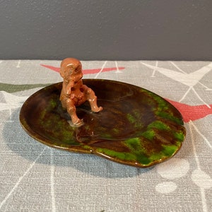 ceramic glazed ashtray | green mottled with child