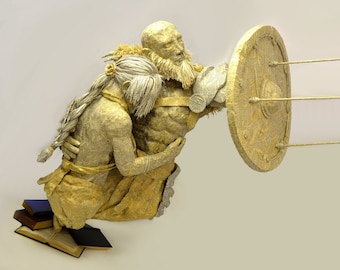 Paper Sculpture. "Beorn and Maya" REMAKE    Viking with shield protecting woman from arrows.   Weathered Romance and War book pages. Indoors