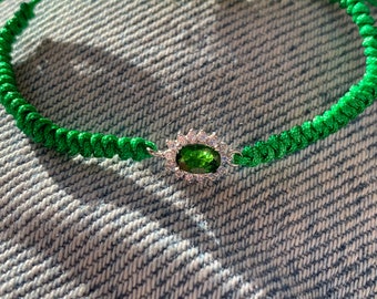 Fine sporty chic bracelet with green natural diopside and cz halo in sterling silver and hand knotted braided cord.